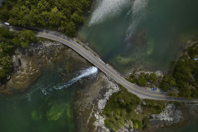 <p>William Hereford</p> An aerial view of a winding road on Maine’s Blue Hill Peninsula