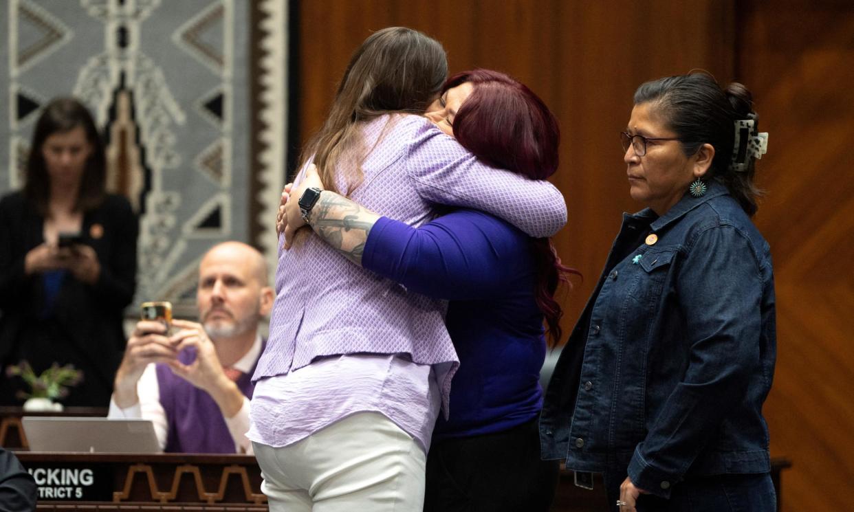 <span>State congresswomen Stephanie Stahl Hamilton and Anna Hernandez celebrate after the house vote.</span><span>Photograph: Rebecca Noble/Reuters</span>