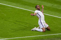 England's Raheem Sterling celebrates after scoring his team's first goal during the Euro 2020 soccer championship group D match between the Czech Republic and England at Wembley stadium, London, Tuesday, June 22, 2021. (Neil Hall/Pool Photo via AP)