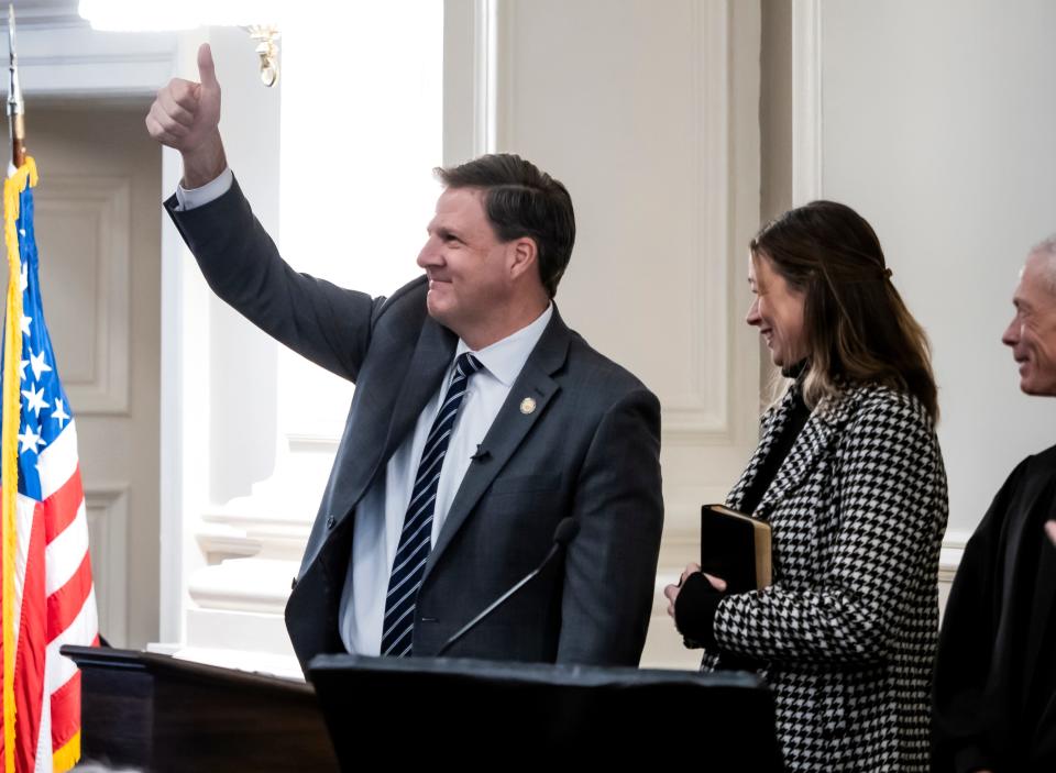 New Hampshire Gov. Chris Sununu gestures after he was sworn in to serve his fourth term by state Supreme Court Chief Justice Gordon MacDonald as first lady Valerie Sununu watches, Thursday, Jan. 5, 2023, at Representative Hall at the State House in Concord.