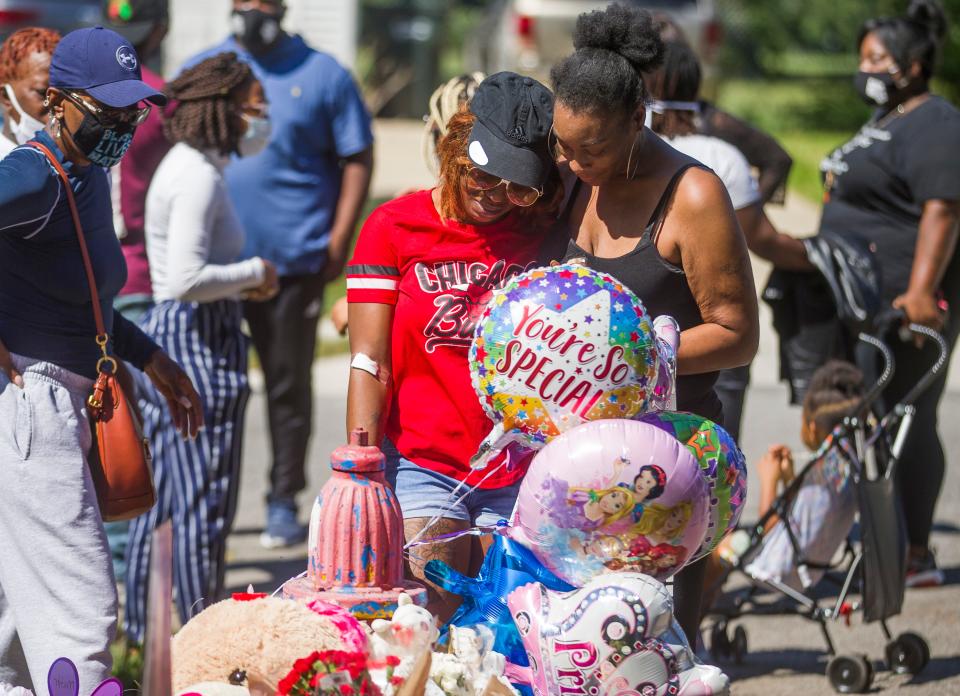 Shanette Smiley, center, mother of Chrisyah Stephens, is comforted at an Aug. 31, 2020 vigil. Chrisyah was killed in a drive-by shooting while attending a birthday party.