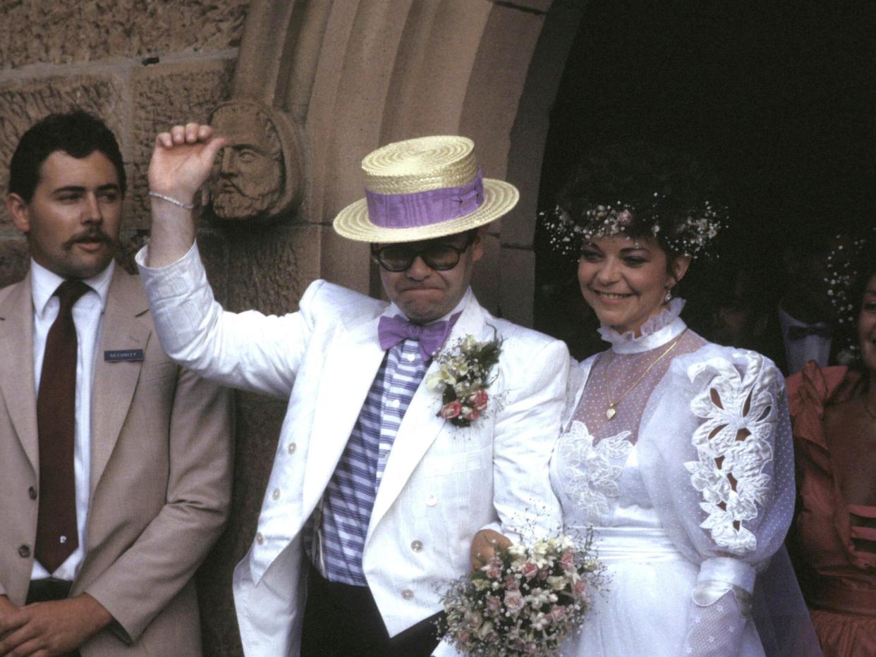 John and Blauel on their wedding day in 1984 (Getty)