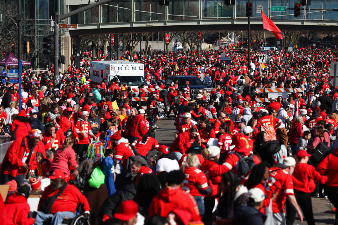 People leave the area following a shooting at Union Station in Kansas City, Mo., on Feb. 14, 2024.