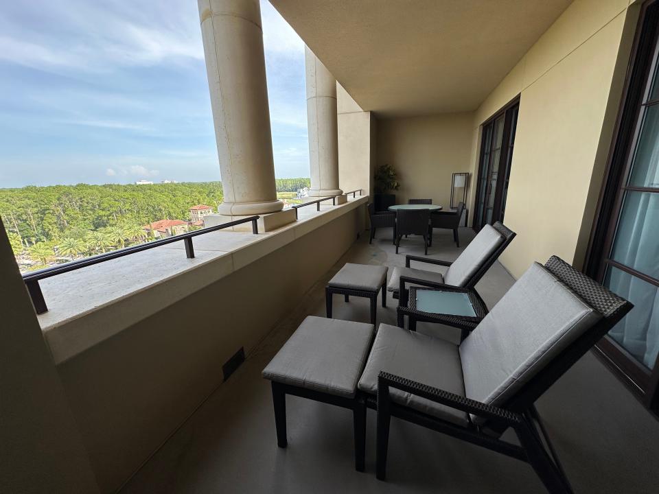 concrete balcony with multiple lounge chairs at Four Seasons Orlando