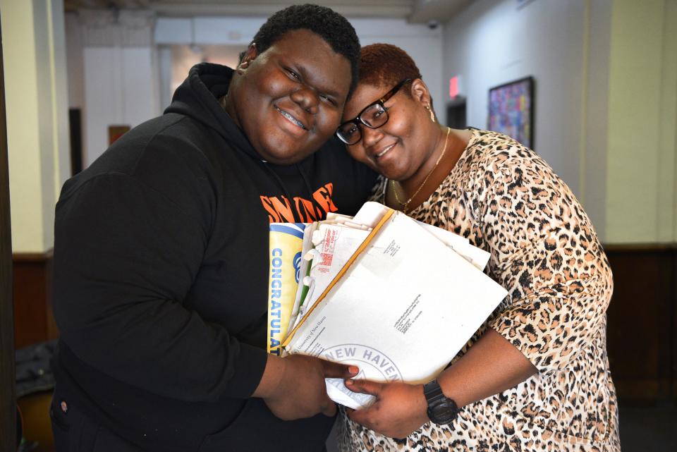 Formerly homeless student Dylan Chidick of Jersey City, NJ and his mother Khadine Phillip, hold his seventeen acceptance letters from college. On Thursday, March 14, 2019 Chidick also received a full scholarship for tuition, room and board from "Give Something Back." Chidick and his mother, Khadine Phillip received housing from Women Rising in Jersey in August 2017.