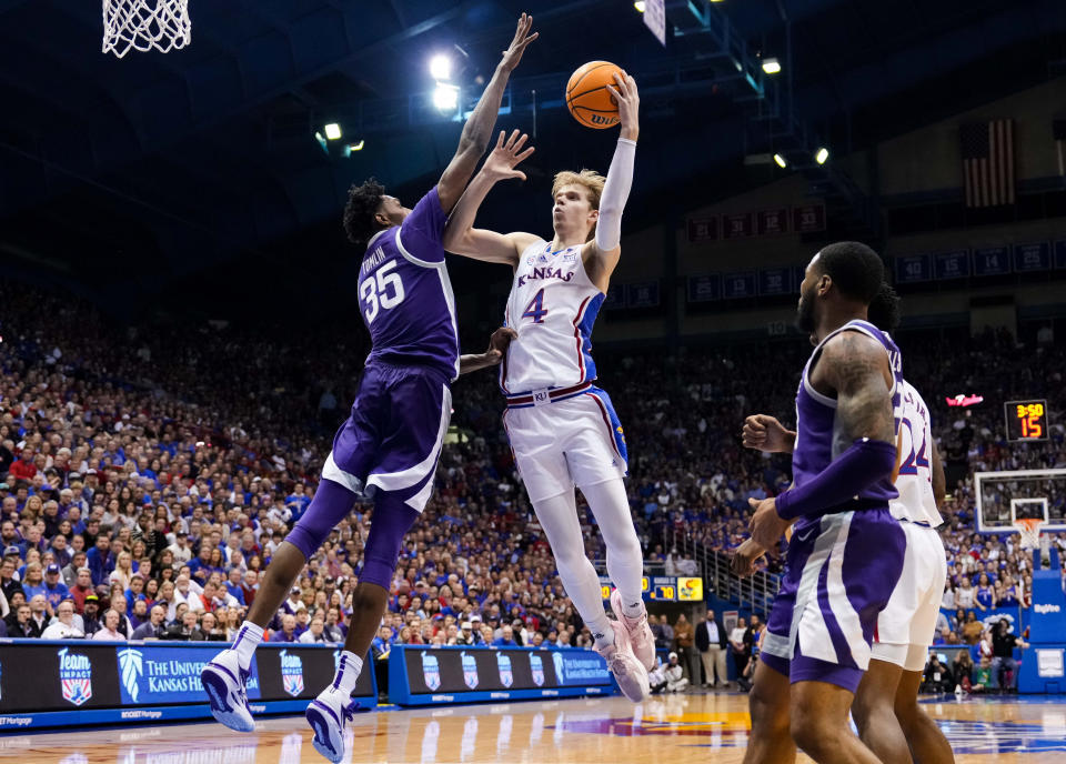 Jan 31, 2023; Lawrence, Kansas, USA; Kansas Jayhawks guard Gradey Dick (4) shoots against Kansas State Wildcats forward Nae'Qwan Tomlin (35) during the second half at Allen Fieldhouse. Mandatory Credit: Jay Biggerstaff-USA TODAY Sports