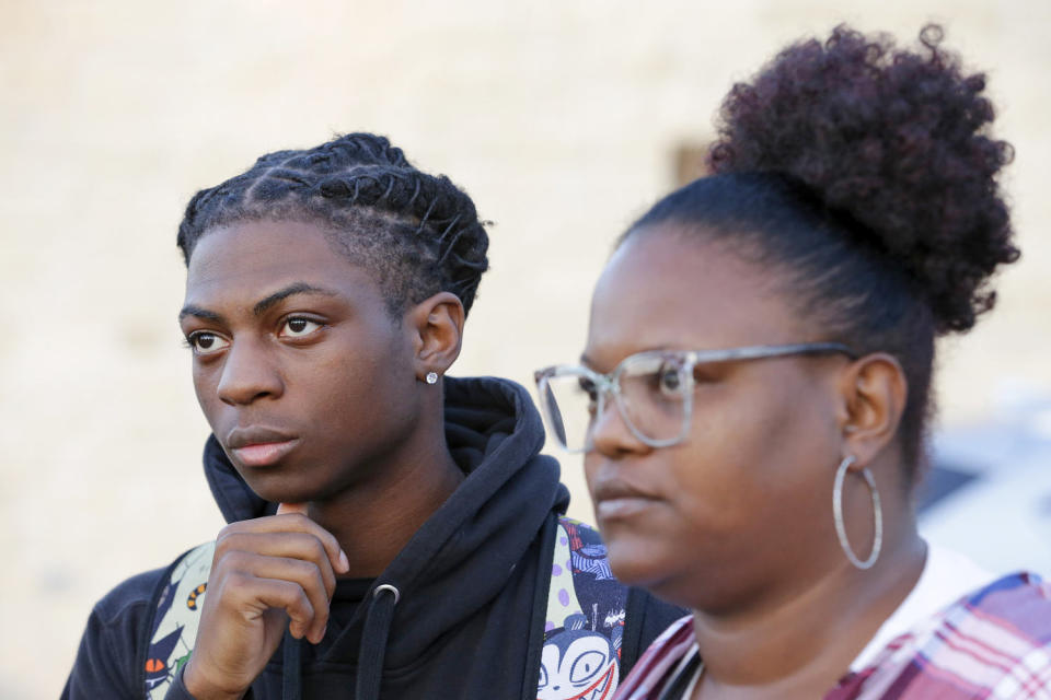 Darryl George, left, 17, and his mother, Darresha George, outside Barbers Hill High School on Sept. 18, 2023, in Mont Belvieu, Texas. Image: (Michael Wyke / AP file)