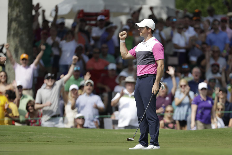 Rory McIlroy, of Northern Ireland, celebrates after sinking his birdie putt on the 18th green to give him the lead during the third round of the World Golf Championships-FedEx St. Jude Invitational Saturday, July 27, 2019, in Memphis, Tenn. McIlroy finished the day at 12-under par, one stroke ahead of Brooks Kopeka. (AP Photo/Mark Humphrey)