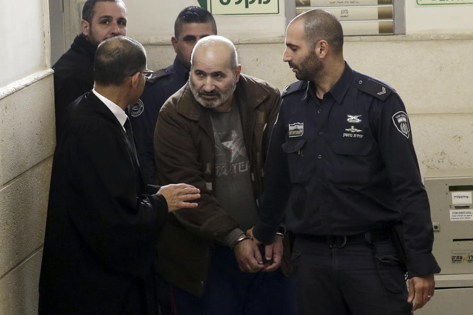 Israeli police escorts a 60-year-old Palestinian Jamil Tamimi into a court in Jerusalem, Thursday, Jan. 10, 2019. Tamimi was sentenced to 18 years for killing British exchange student Hannah Bladon on the Jerusalem light rail in April 2017. Tamimi's defense team claimed he suffered from a mental illness, and the attack was not ideologically or politically motivation. (AP Photo/Mahmoud Illean)