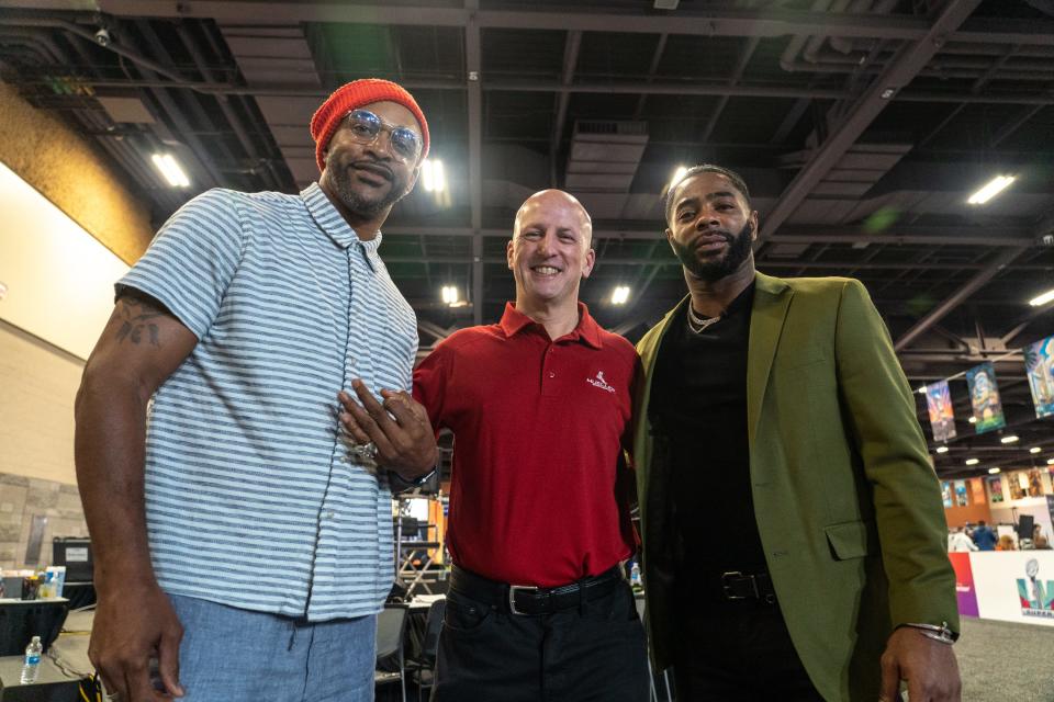 Former NFL player David Tyree (left), John Cayer, president of Mueller Sports Medicine (center) and NFL player Malcolm Butler (right) pose for a portrait at the Super Bowl 57 Experience's Radio Row at the Phoenix Convention Center in Phoenix on Feb. 9, 2023.