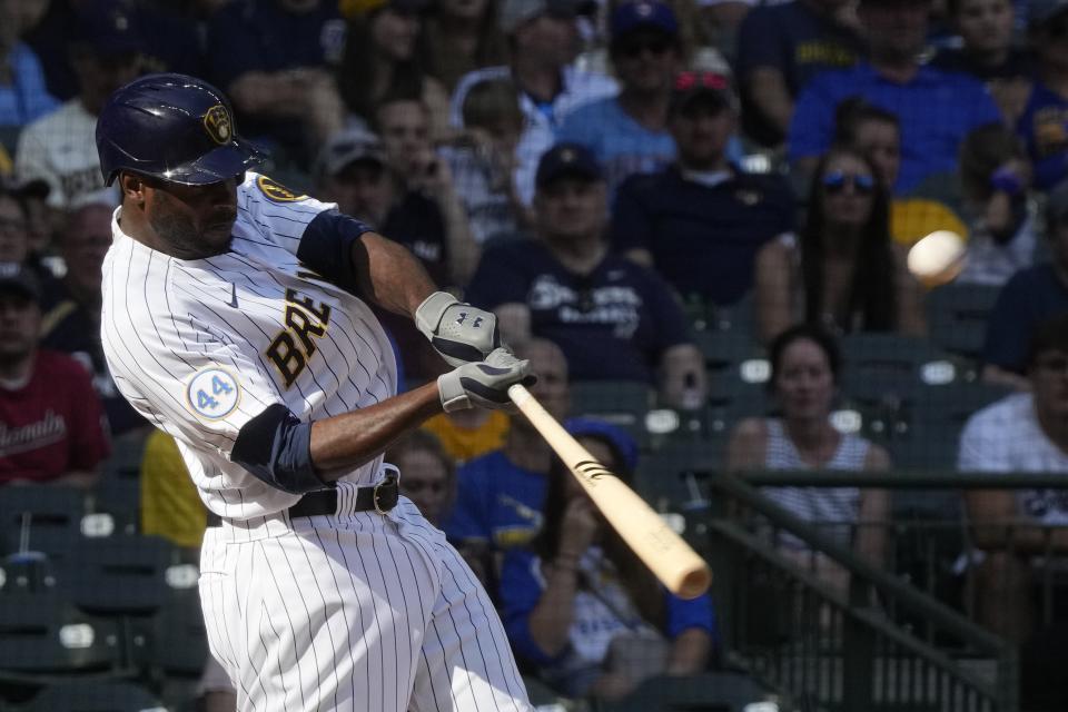 Milwaukee Brewers' Lorenzo Cain hits a two-run home run during the seventh inning of a baseball game against the Washington Nationals Sunday, Aug. 22, 2021, in Milwaukee. (AP Photo/Morry Gash)