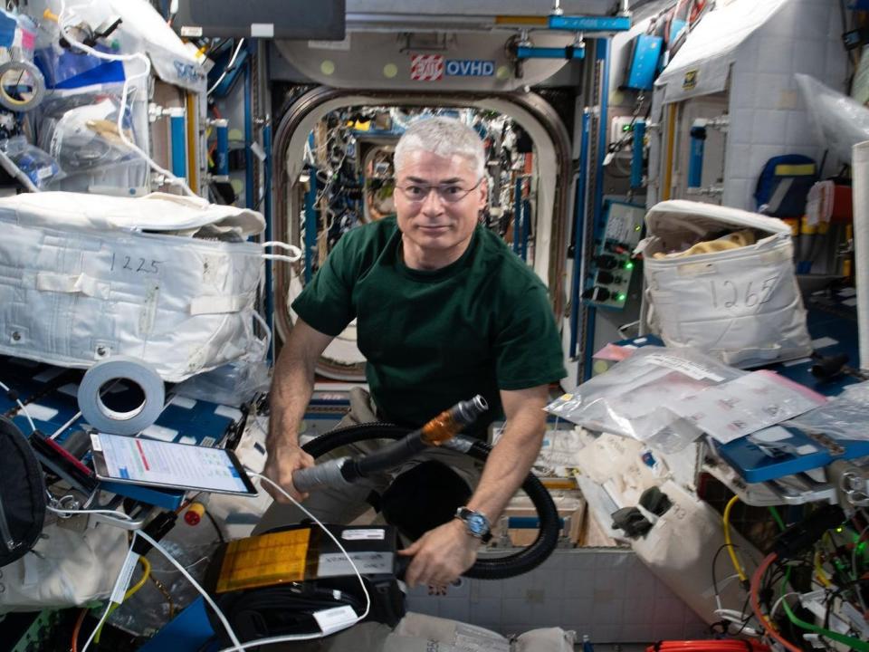 nasa astronaut mark vande hei floating inside international space station with supplies equipment