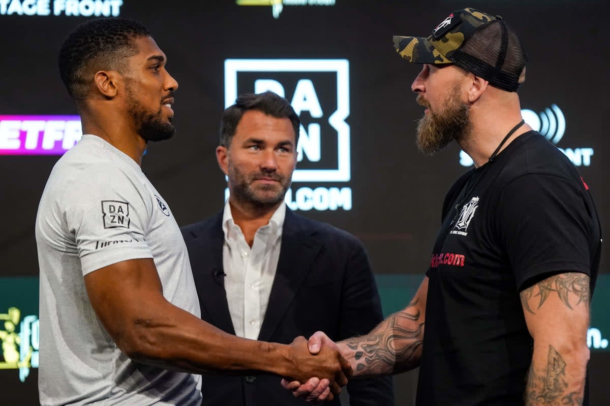 Joshua and Helenius at their pre-fight press conference – the pair sparred in 2017, as Joshua prepared for his fight with Wladimir Klitschko (PA Wire)