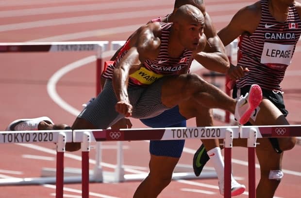 Canada's Damian Warner ran to an Olympic best in the men's decathlon 110-metre hurdles on Thursday at the Tokyo Games. (Ina Fassbender/AFP via Getty Images - image credit)