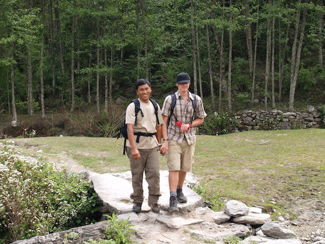 Nepali man holding hands with a male tourist (Photo: Steve Hicks via flickr)