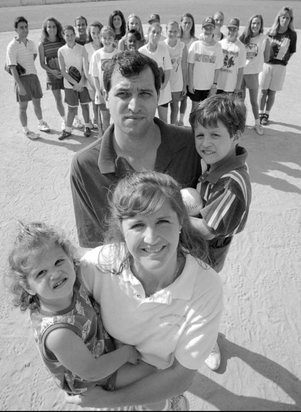 5/03/94 6B BOB LEVERONE/Staff JUGGLING ACT: Providence Day softball coach Barbara Nelson and husband Vernon have their hands full with daughter Haley, 2, and son Quinn, 5. The Chargers (background) are her second family. BOB LEVERONE
