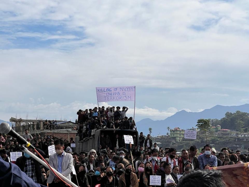 People attend the funeral of civilians killed by Indian army soldiers on Saturday, who mistakenly believed some of them were militants, and one who was killed when soldiers fired at a crowd of protestors on Sunday, in Mon, in the northeastern Indian state of Nagaland, Monday, Dec. 6, 2021. (AP Photo/Fifi Konyak)