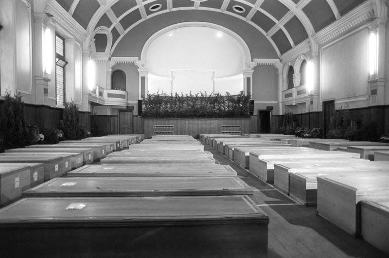 Almost 90 pine coffins of victims of the Pan Am Boeing 747 which crashed on to the town of Lockerbie, in four rows in the makeshift Chapel of Rest in Lockerbie’s Town Hall.