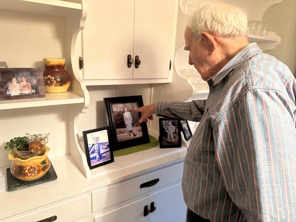 Ray Bower points to a photograph of his late wife, Jean.