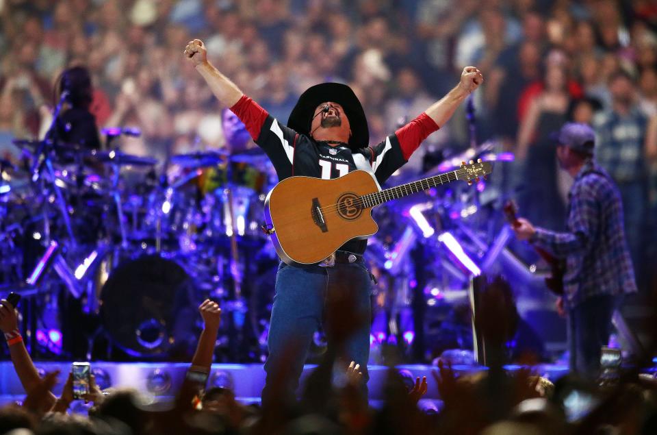 Country music legend Garth Brooks performs to over 75,000 fans, the largest indoor concert crowd ever in Arizona, at State Farm Stadium on March 23, 2019, in Glendale, Ariz.