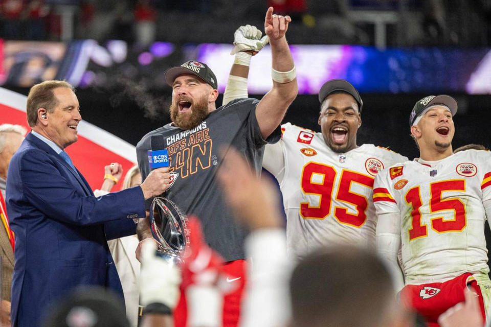 Kansas City Chiefs tight end Travis Kelce, left, celebrates with teammates defensive tackle Chris Jones (95) and quarterback Patrick Mahomes (15) after defeating the Baltimore Ravens 17-10 in the AFC Championship Game at M&T Bank Stadium on Sunday, Jan. 28, 2024, in Baltimore.  / Credit: Emily Curiel/The Kansas City Star/Tribune News Service via Getty Images