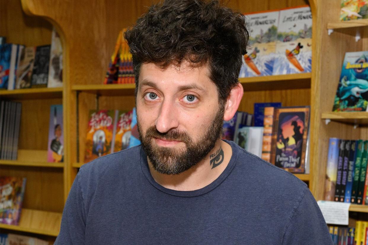 NAPERVILLE, ILLINOIS - SEPTEMBER 14: Joe Trohman signs copies of his new book 