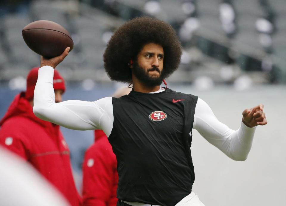 FILE - In this Dec. 4, 2016, file photo, San Francisco 49ers quarterback Colin Kaepernick warms up before an NFL football game against the Chicago Bears. Spike Lee said on Instagram Sunday, March 19, 2017, that it was "fishy" that Kaepernick, now a free agent, hadn't been signed." (AP Photo/Charles Rex Arbogast, File)