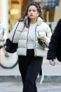 <p>A bundled Rosalía grabs a green juice on Tuesday in New York City.</p>