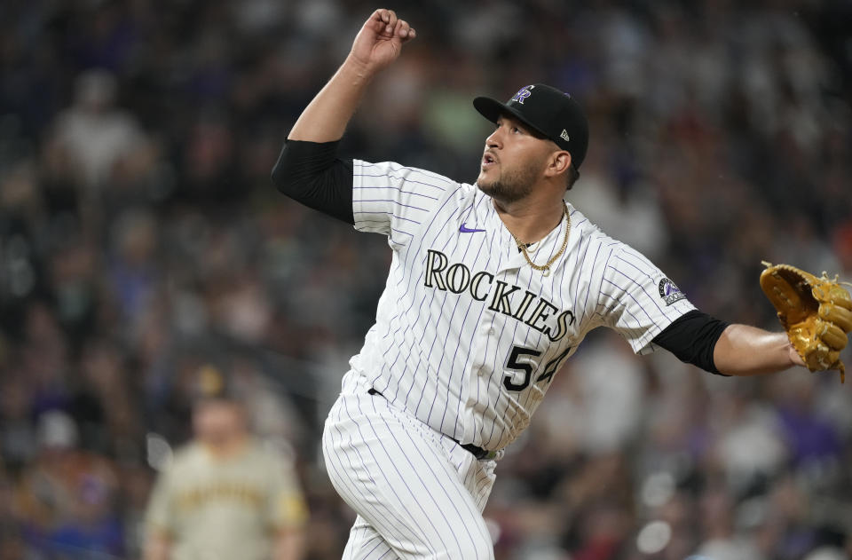 Colorado Rockies relief pitcher Carlos Estevez works against the San Diego Padres in the eighth inning of a baseball game Friday, June 17, 2022, in Denver. (AP Photo/David Zalubowski)