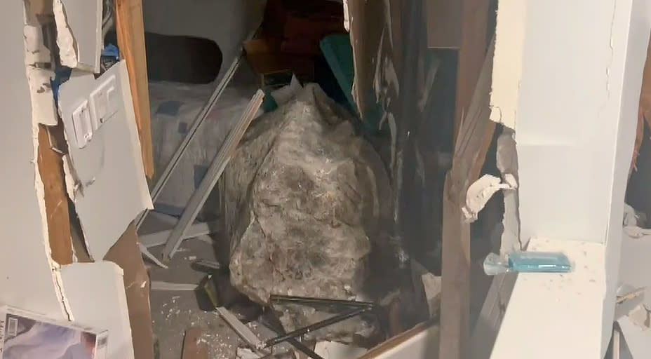 A boulder that crashed into a home in Honolulu, Hawaii. The Fire Department said the boulder is about 5 feet in height and width. (KHNL)
