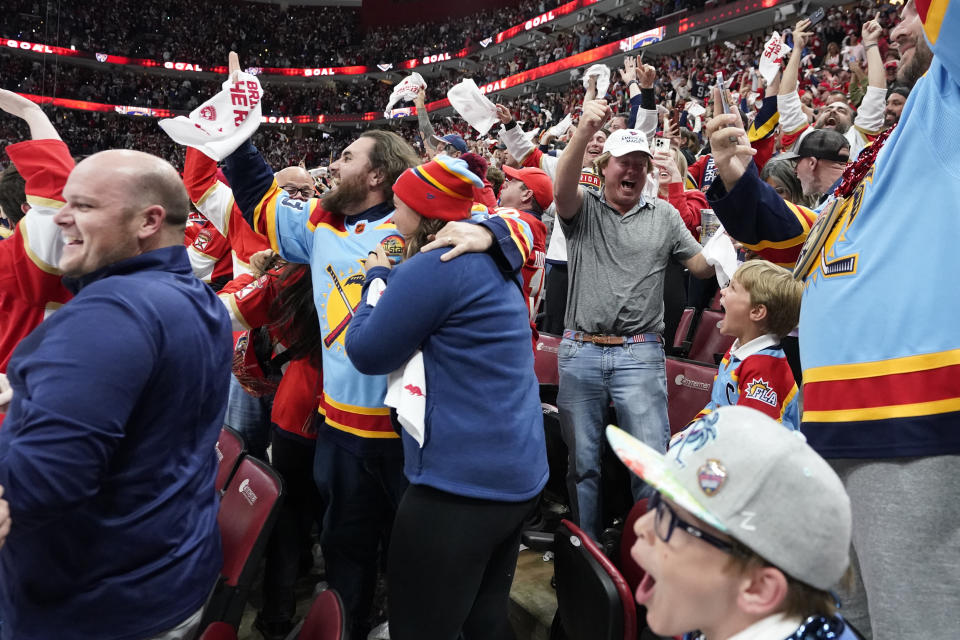 Fans react after Florida Panthers left wing Matthew Tkachuk scored a power-play goal with 4.9 seconds left in the third period of Game 4 of the NHL hockey Stanley Cup Eastern Conference finals against the Carolina Hurricanes, Wednesday, May 24, 2023, in Sunrise, Fla. (AP Photo/Wilfredo Lee)