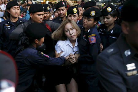 A student activist is detained during a silent protest after Thailand's election commission filed charges against a group for posting "foul and strong" comments online criticising a military-backed draft constitution, in Bangkok, Thailand April 27, 2016. REUTERS/Jorge Silva