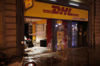 A vandalized shop is seen on a street the morning after clashes between police and protesters wearing yellow vests, a symbol of a French drivers' protest against higher diesel taxes, in Paris, France, December 2, 2018. REUTERS/Benoit Tessier