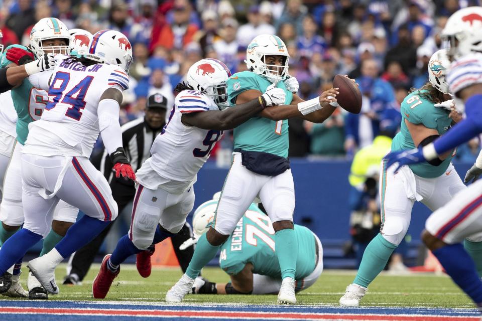 Miami Dolphins quarterback Tua Tagovailoa (1) is sacked by Buffalo Bills defensive end Mario Addison (97) during an NFL football game, Sunday, Oct. 31, 2021 in Orchard Park, NY. (AP Photo/Matt Durisko)