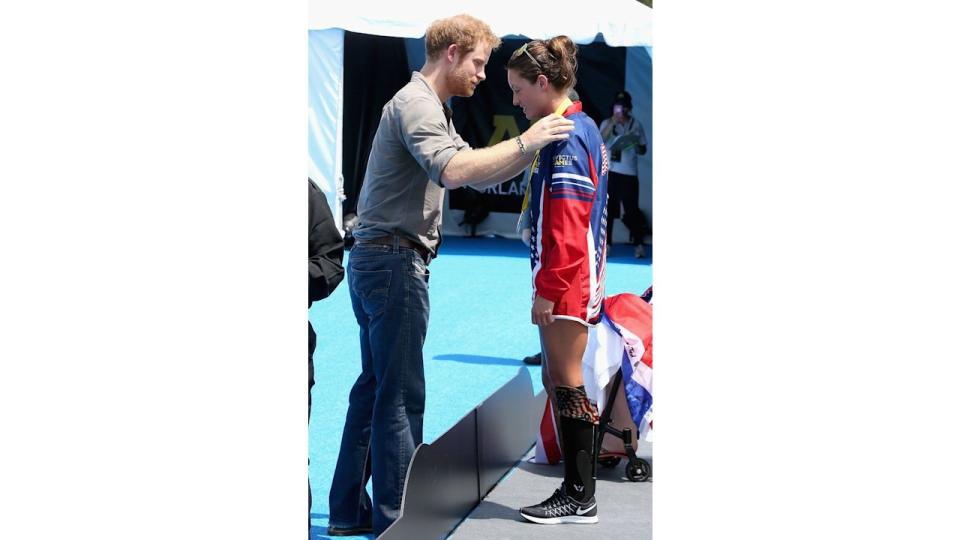 Prince Harry presenting gold medal to Elizabeth Marks in Orlando