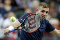 Tennis - Canada v Britain - Davis Cup World Group First Round - Ottawa, Ontario, Canada - 3/2/17. Britain's Daniel Evans hits a shot during his singles match against Canada's Denis Shapovalov. REUTERS/Chris Wattie