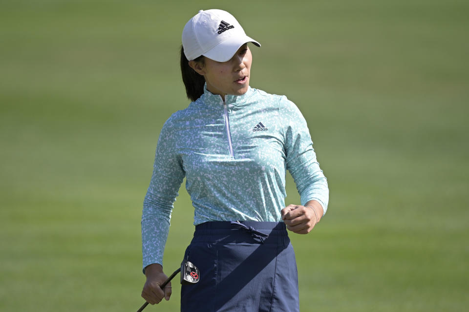 Danielle Kang celebrates after making a putt on the seventh green during the final round of the Tournament of Champions LPGA golf tournament, Sunday, Jan. 24, 2021, in Lake Buena Vista, Fla. (AP Photo/Phelan M. Ebenhack)