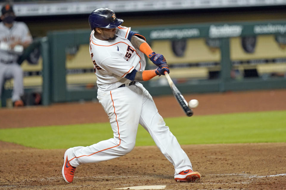 Houston Astros' Martin Maldonado hits a three-run home run against the San Francisco Giants during the sixth inning of a baseball game Wednesday, Aug. 12, 2020, in Houston. (AP Photo/David J. Phillip)