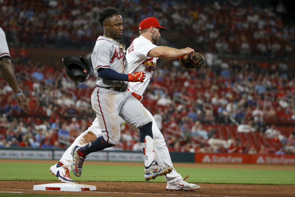 Atlanta Braves' Ozzie Albies is out at first after grounding into a double play during the fifth inning of the team's baseball game against the St. Louis Cardinals on Tuesday, April 4, 2023, in St. Louis. (AP Photo/Scott Kane)