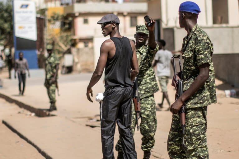 Gambian soldiers patrol the streets of Banjul after the presidential elections on December 2, 2016