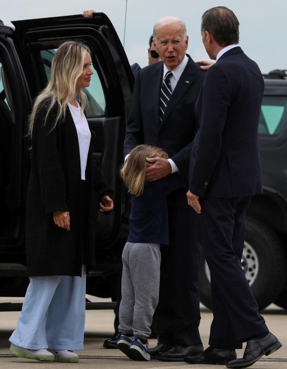 U.S. President Joe Biden embraces his grandson Beau Biden, his daughter-in-law Melissa Cohen Biden, and his son Hunter Biden, who was found guilty on all three counts of possession of a firearm earlier in the day, June 11, 2024.