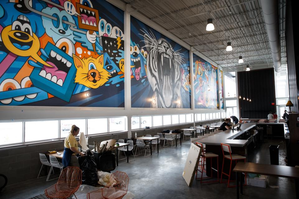 Murals grace the taproom at Waukee's Kinship Brewing.