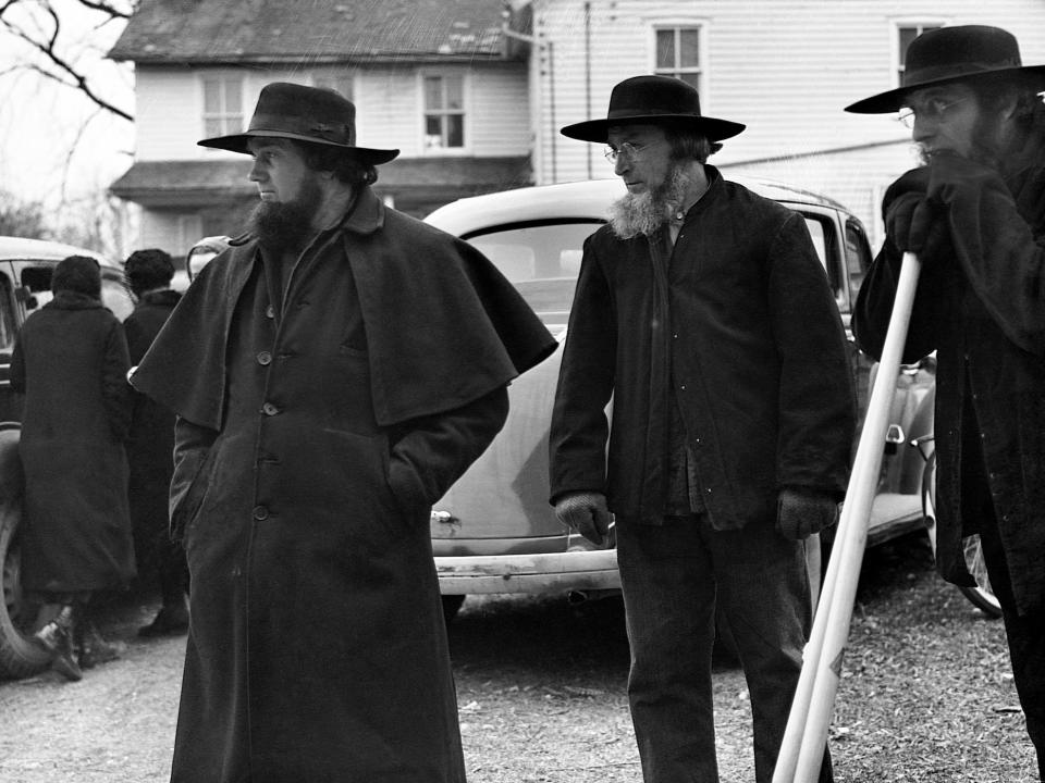 A group of Amish men attending a farm auction in Lancaster County, Pennsylvania in 1942.