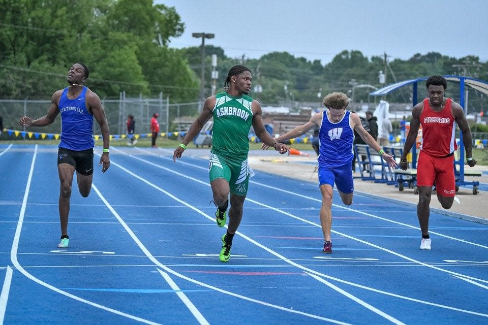 Ashbrook's Sincere Sanders Moss crosses the finish line to claim the NCHSAA Class 3A 200-meter title May 19, 2023 in Greensboro.