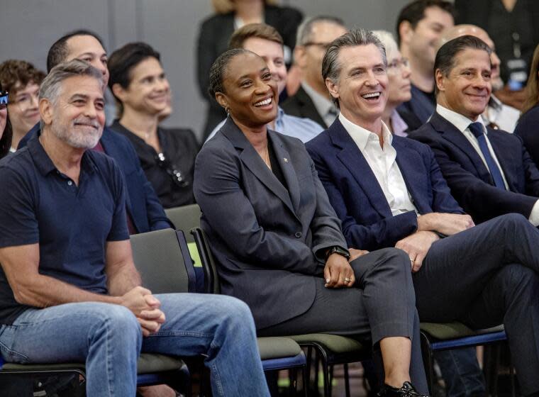 LOS ANGELES, CA-OCTOBER 13, 2023:Left to right-Actor George Clooney, U.S. Senator Laphonza Butler, California Governor Gavin Newsom, and L.A. Unified Superintendent Alberto Carvalho, react while listening to actor Don Cheadle address gathering during celebration of the 2nd year of the Roybal School of Film and Television Production Magnet in downtown Los Angeles. (Mel Melcon/Los Angeles Times)