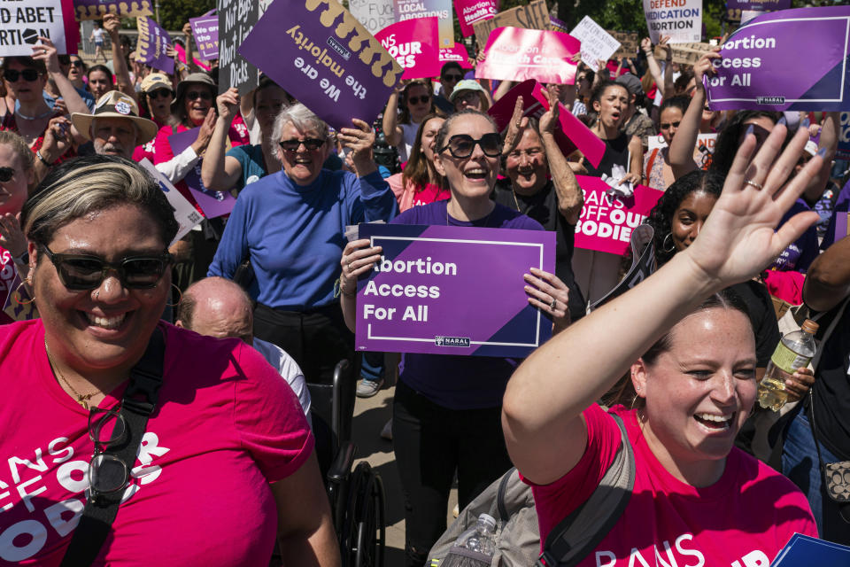 FILE - Protesters cheer during a Planned Parenthood rally in support of abortion access outside the U.S. Supreme Court, April 15, 2023, in Washington. A new poll from from AAPI Data and The Associated Press-NORC Center for Public Affairs Research shows that Asian Americans, Native Hawaiians and Pacific Islanders in the U.S. are highly supportive of legal abortion, even in situations where the pregnant person wants an abortion for any reason. (AP Photo/Nathan Howard, File)