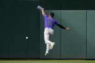 Colorado Rockies center fielder Yonathan Daza leaps but misses a ball that went for a double by Washington Nationals' Keibert Ruiz during the third inning of the second baseball game of a doubleheader, Saturday, May 28, 2022, in Washington. (AP Photo/Nick Wass)