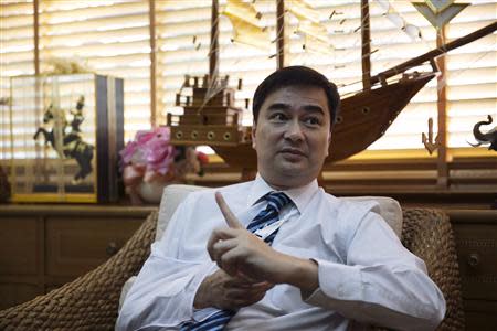 Thailand's opposition leader and former Prime Minister Abhisit Vejjajiva gestures during an interview with foreign media at his Democrat Party headquarters in Bangkok April 23, 2014. AREUTERS/Darren Whiteside