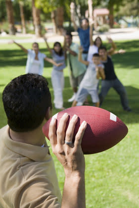 <div class="caption-credit"> Photo by: Shutterstock</div><div class="caption-title">Family football</div>Get your family off the couch and outside for a friendly game of touch football! Touchdown! <br> <a rel="nofollow noopener" href="http://blogs.babble.com/family-style/2011/12/28/17-kids-fashions-we-hope-disappear-by-2012/" target="_blank" data-ylk="slk:Related: 17 fashion trends that need to disappear this year;elm:context_link;itc:0;sec:content-canvas" class="link "><b><i>Related: 17 fashion trends that need to disappear this year </i></b></a> <br>