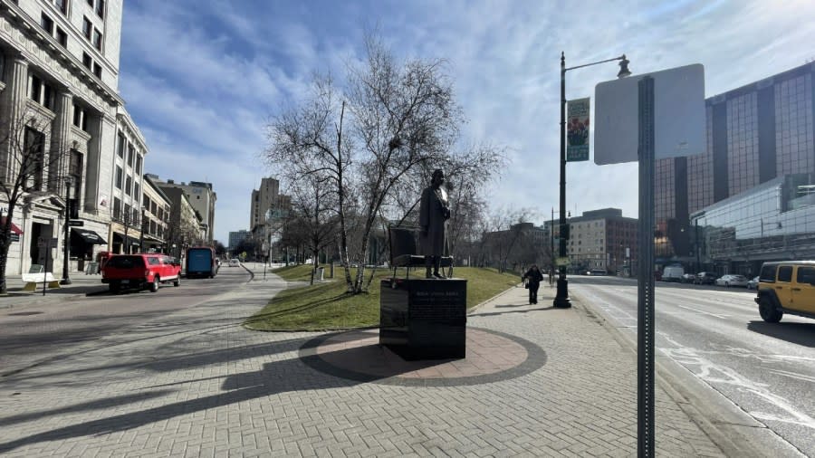 A bronze statue of Rosa Parks outside of Rosa Parks Circle in downtown Grand Rapids.